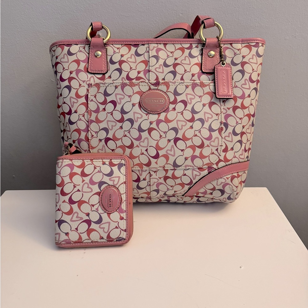 Coach leather hand bag with matching wallet.